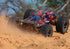 Traxxas Sledge RTR 6S 4WD Brushless 1/8 Monster Truck Orange με Belted Sledgehammer Tires, TQi & TSM